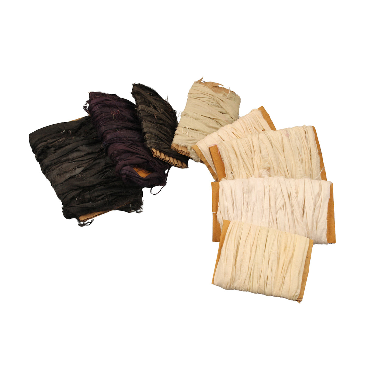 Black and ivory sari silk ribbons displayed on individual cardboard cards