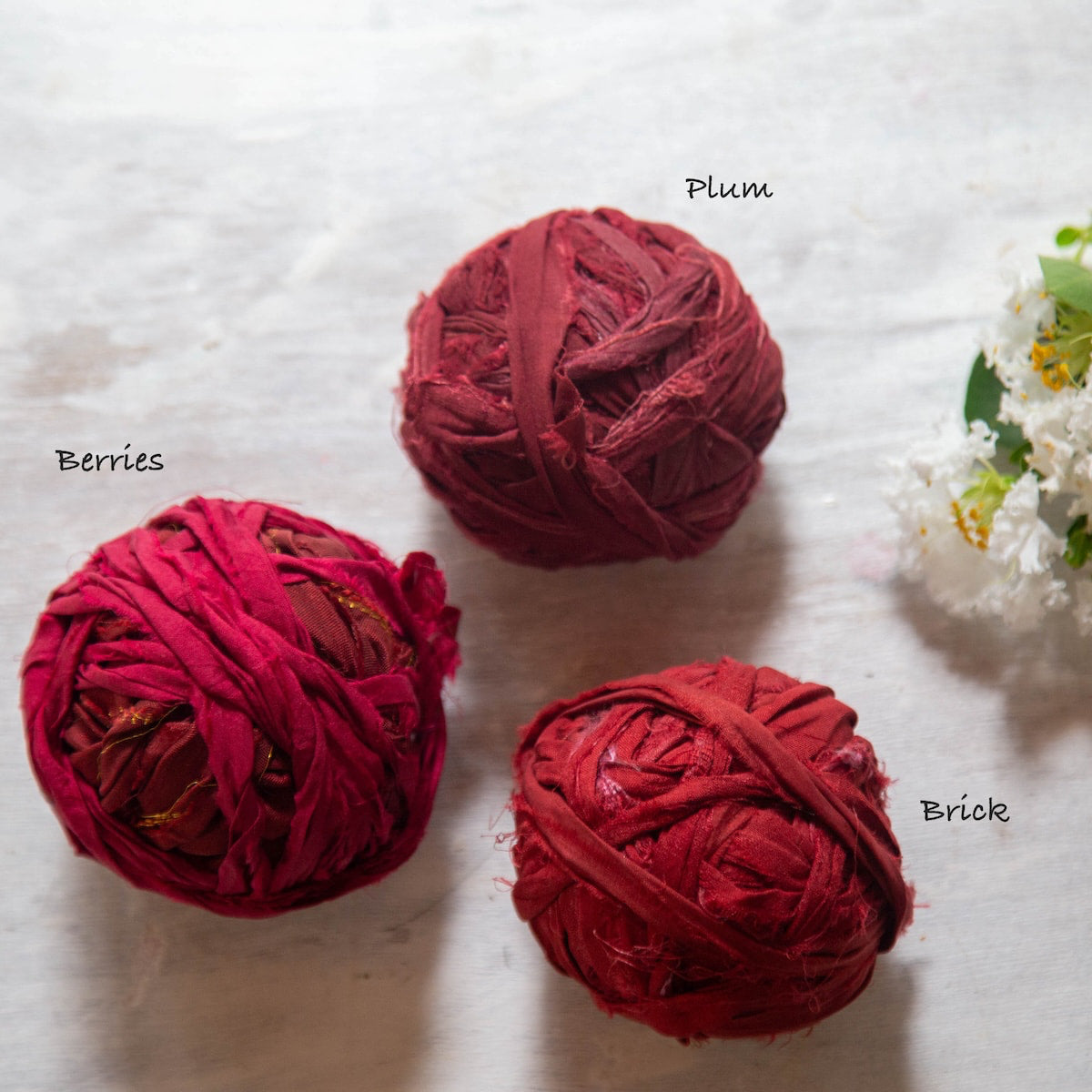 Three different shades of red sari silk ribbons