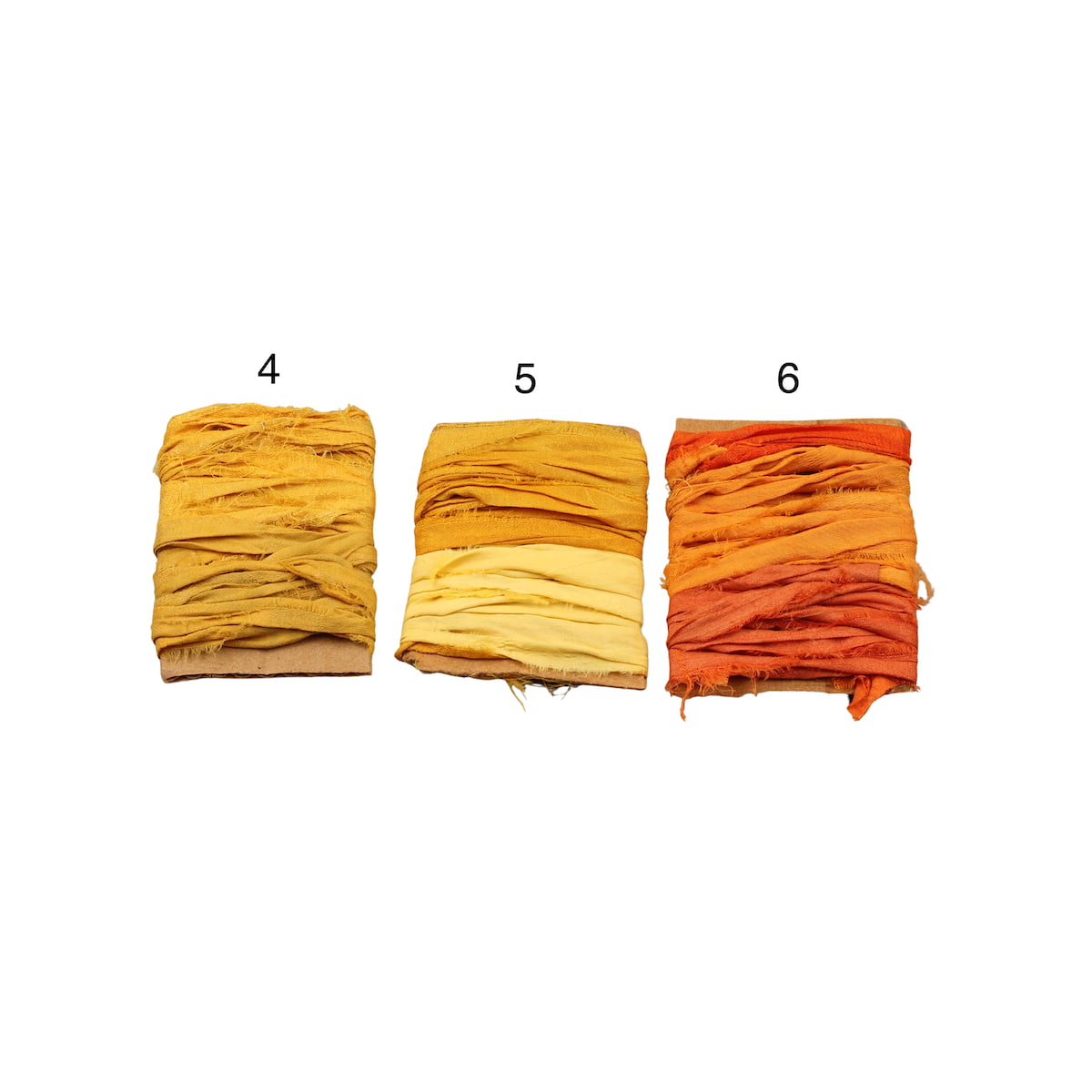 Two solid yellow sari silk ribbons with one orange shade ribbon