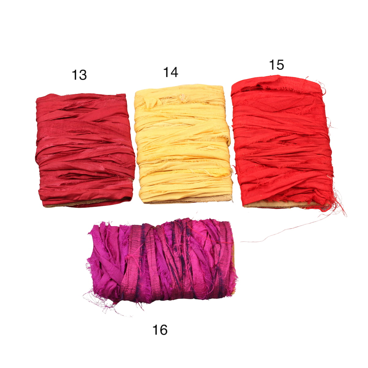 Yellow and red sari silk ribbons displayed in varied shades