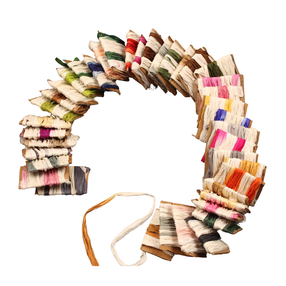 Dip dye sari silk ribbons in 40 assorted shades with ivory base, displayed on cardboard
