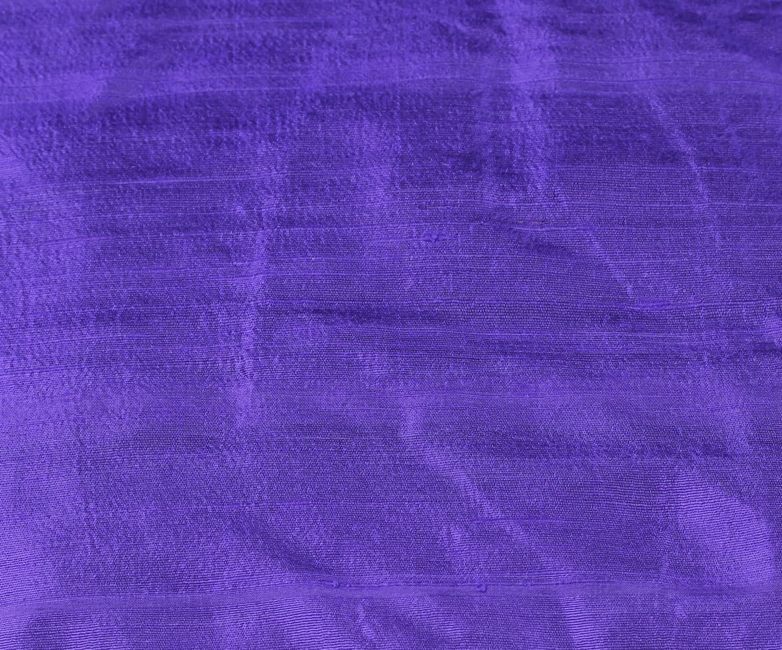 Close-up of Blue Violet Dupion Silk Fabric showing natural slub texture, woven silk detail, and rich violet-blue colour
