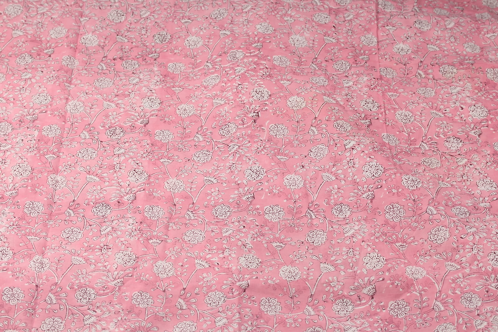 Blush Marigold Sprig hand block printed cotton fabric featuring ivory floral sprigs and botanical vines on a blush pink background