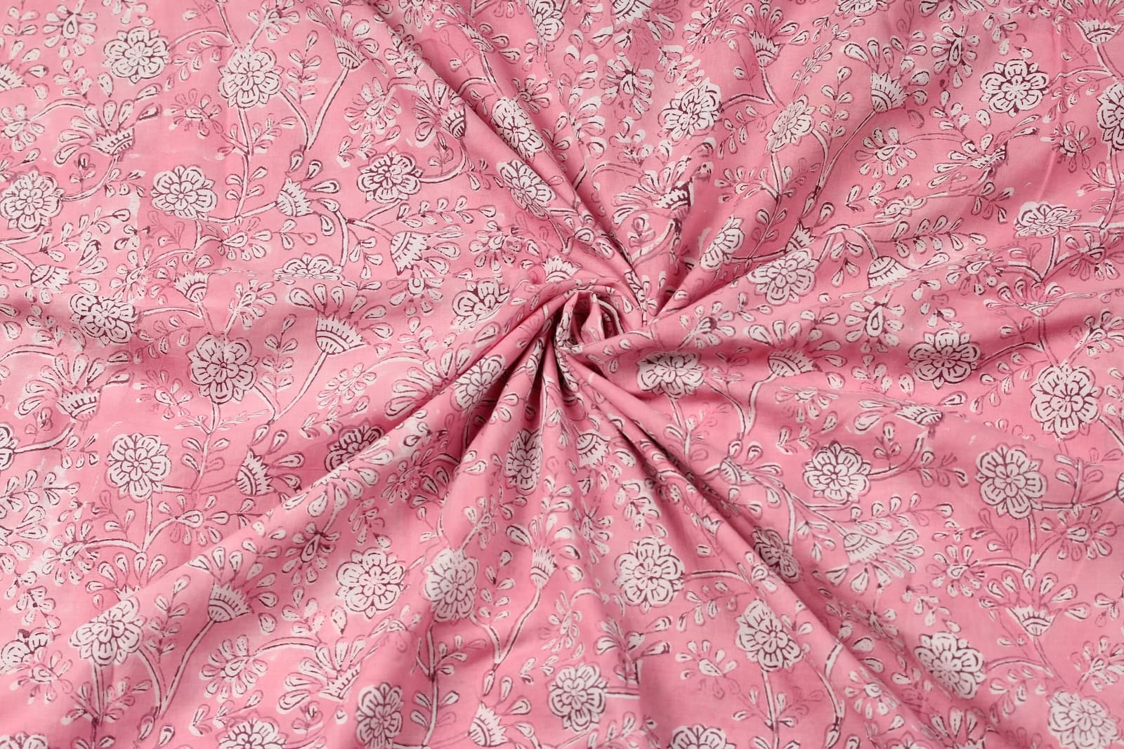 Blush Marigold Sprig floral block print cotton fabric gathered to showcase drape, texture, and pattern detail