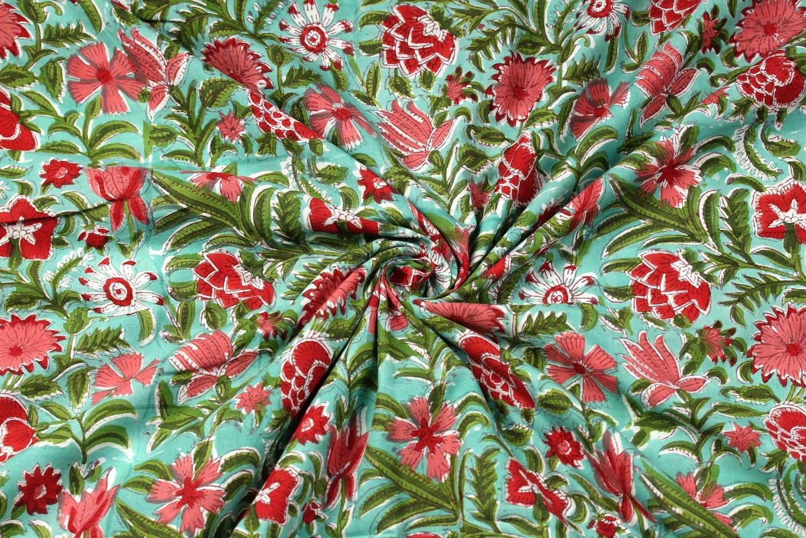 Coral Wildflower Meadow block printed cotton fabric draped to show softness and movement