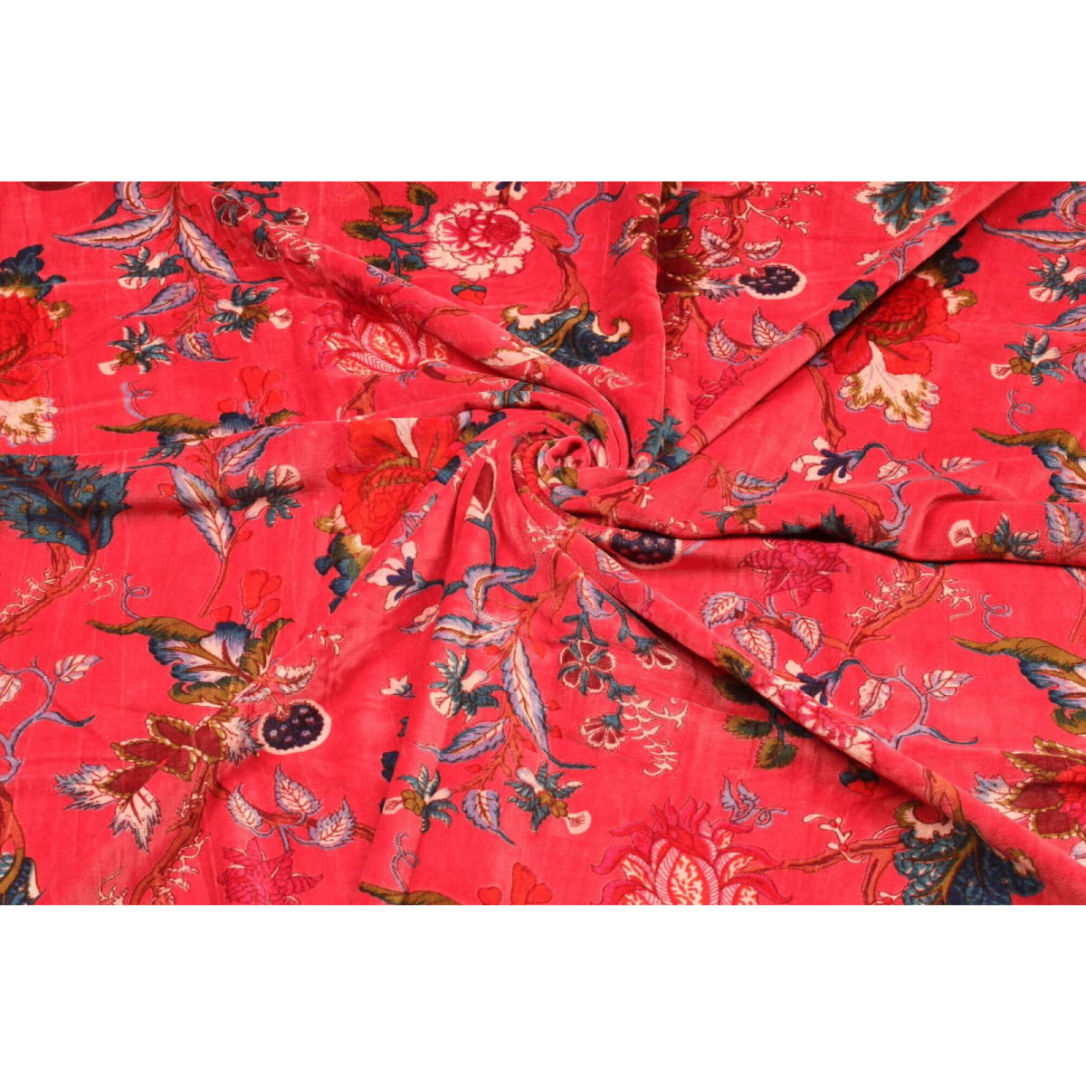 Folded red velvet showing soft texture and rich floral design