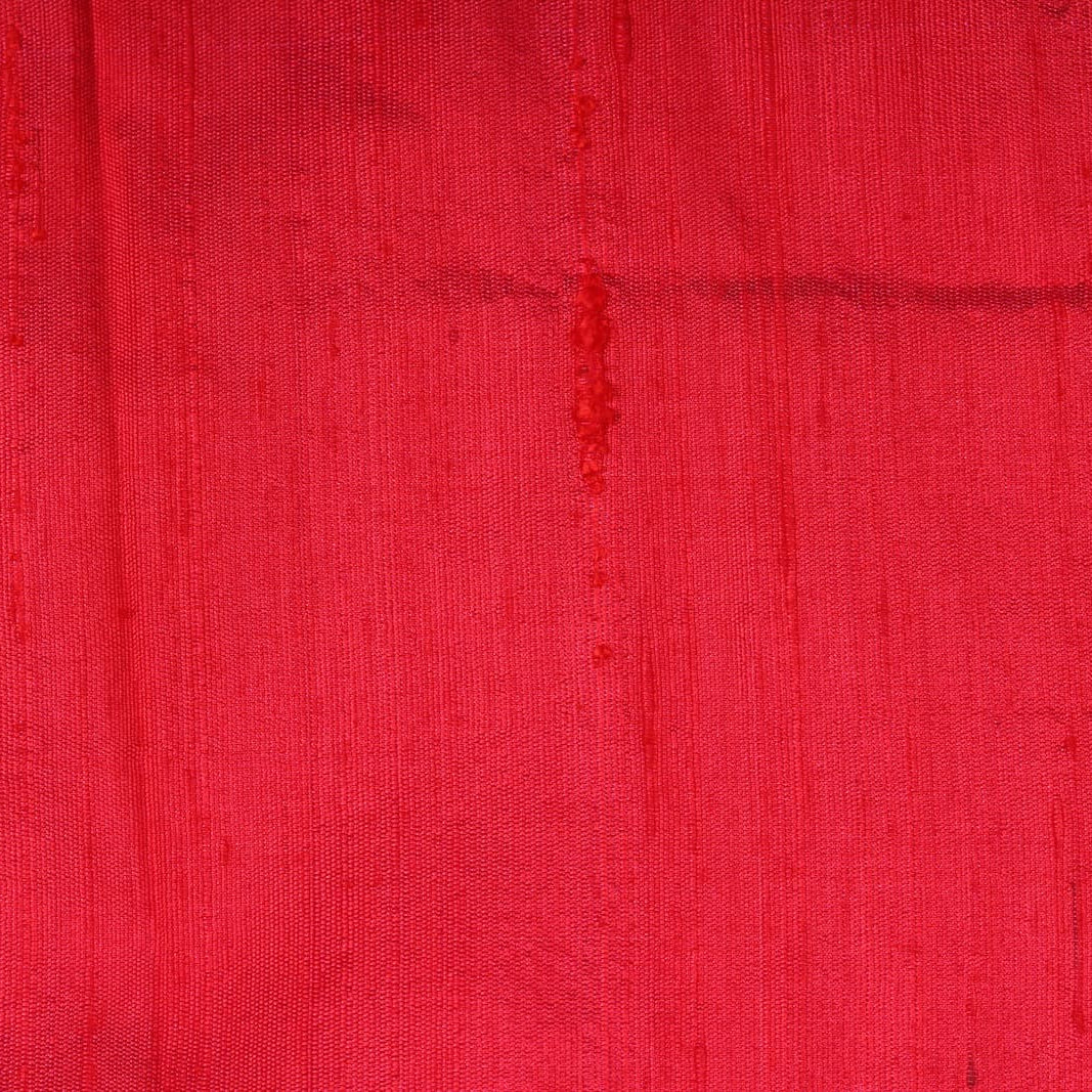 Close-up of Electric Pink Dupion Silk Fabric showing natural slub texture, woven silk detail, and rich colour variation