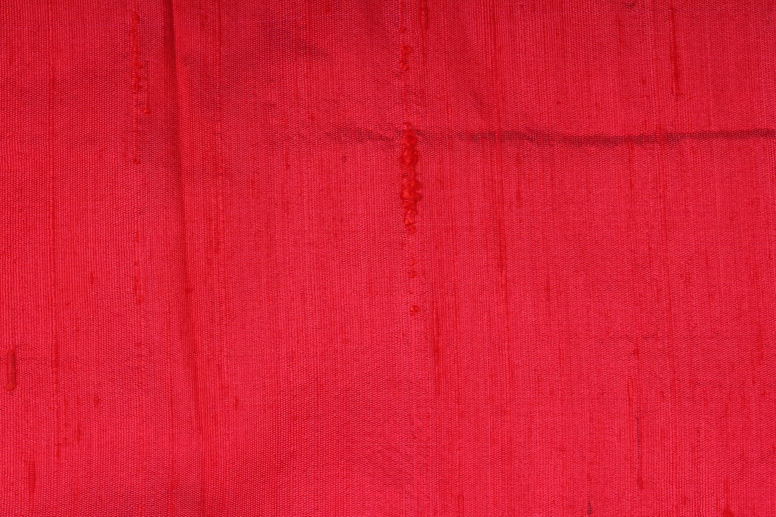 Close-up of Electric Pink Dupion Silk Fabric showing natural slub texture, woven silk detail, and rich colour variation