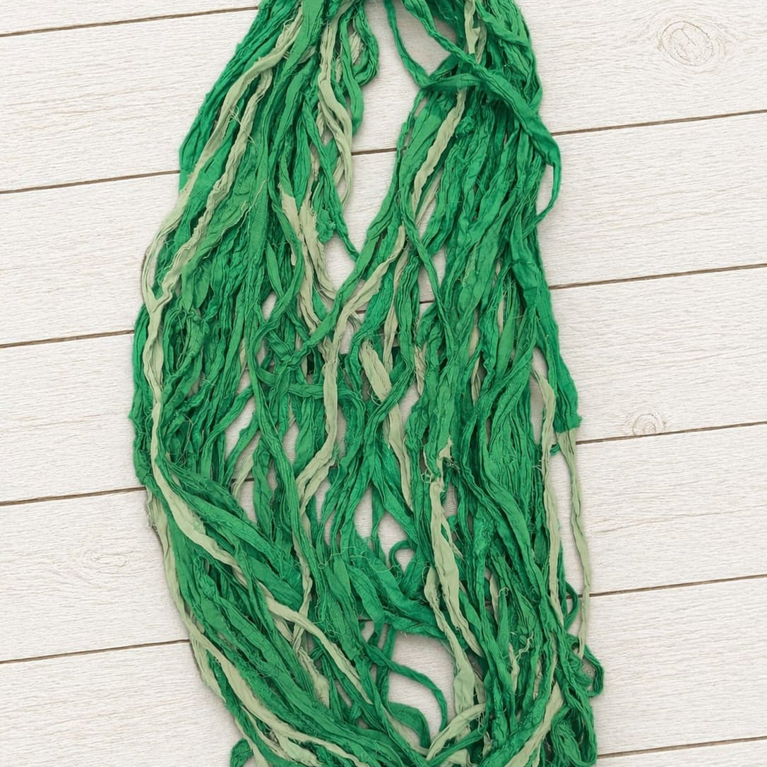 Hand dyed Spring Fern sari silk ribbon yarn draped to display texture