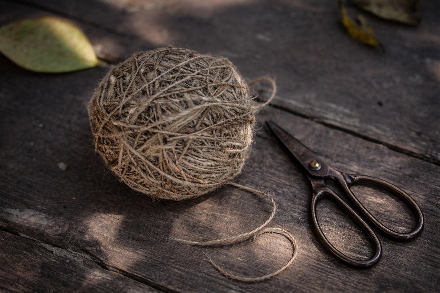 Natural nettle fiber yarn strand detail showing handspun thickness and texture