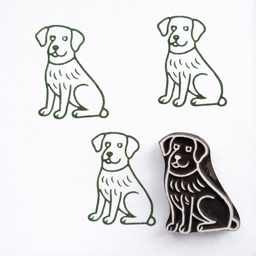 Labrador dog block print stamp with green ink impressions on paper