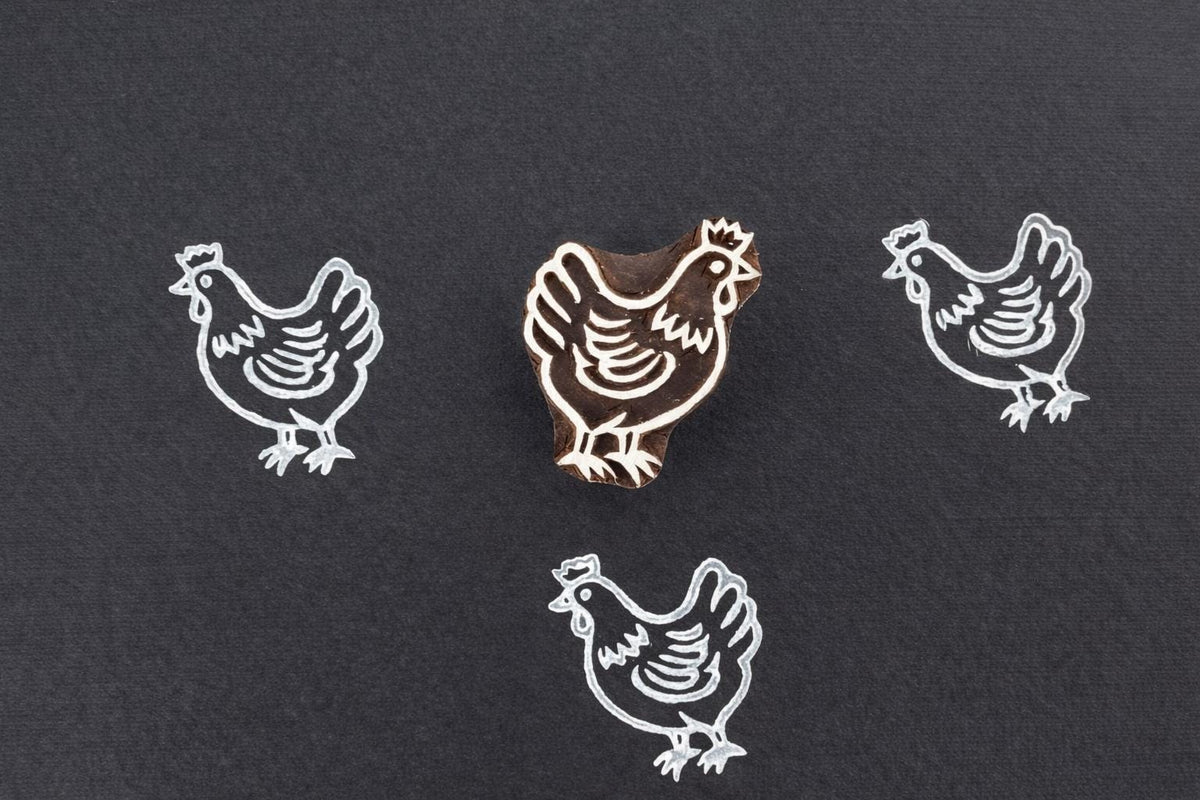 Chicken wooden block printing stamp hand carved from wood for fabric printing, pottery stamping and textile crafts.