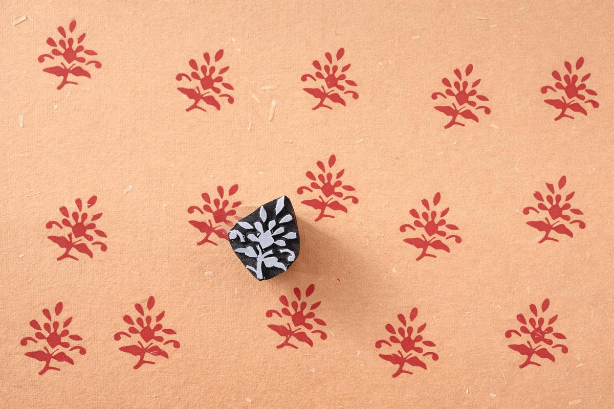 Hand carved Indian flower wood stamp printing red pattern on handmade paper