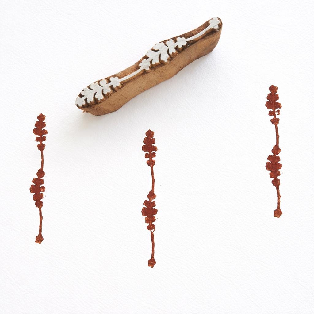 Hand carved wooden stamp printing small vertical floral strip border pattern