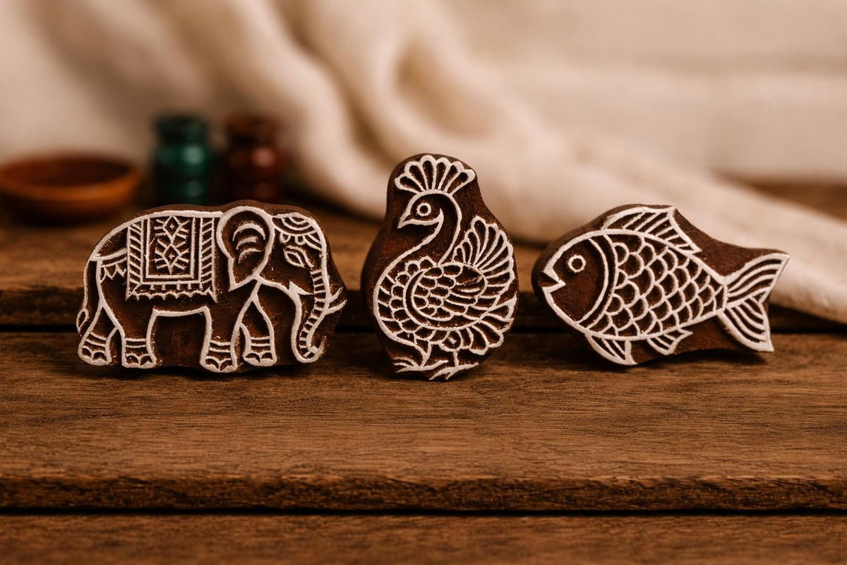 Indian wooden printing blocks set with elephant peacock and fish designs for fabric textile and clay printing