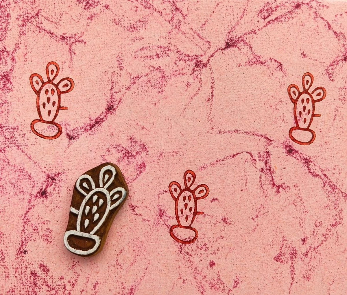 Potted Cactus stamp printing red pattern on textured pink background