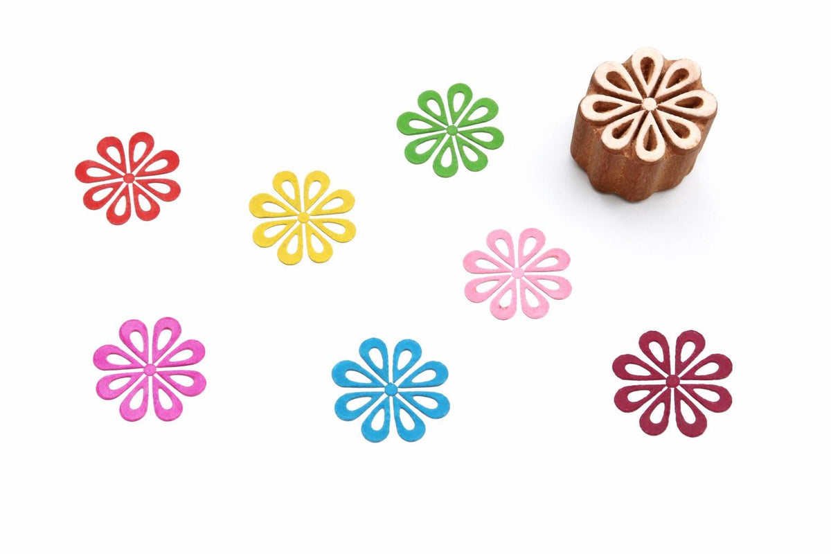 Hand carved wooden stamp with looped petal flower design