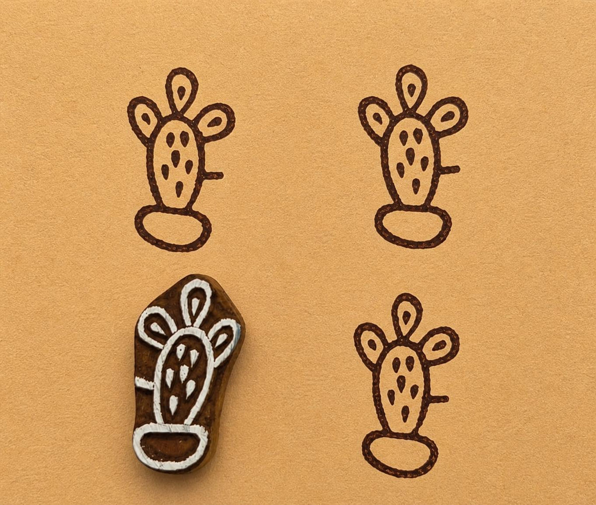 Potted Cactus stamp printing pattern on mustard background