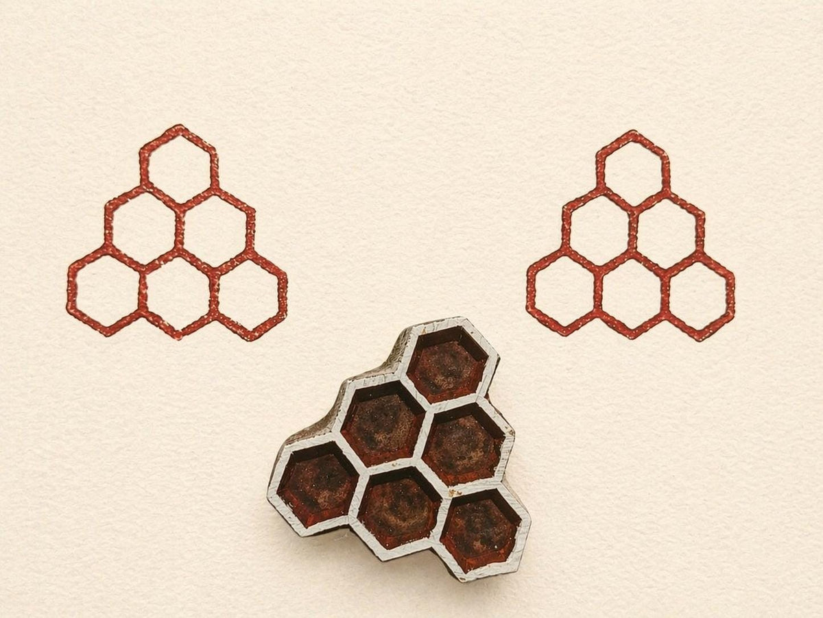 Wooden block print stamp with geometric hexagon cluster creating a clean honeycomb pattern on neutral background