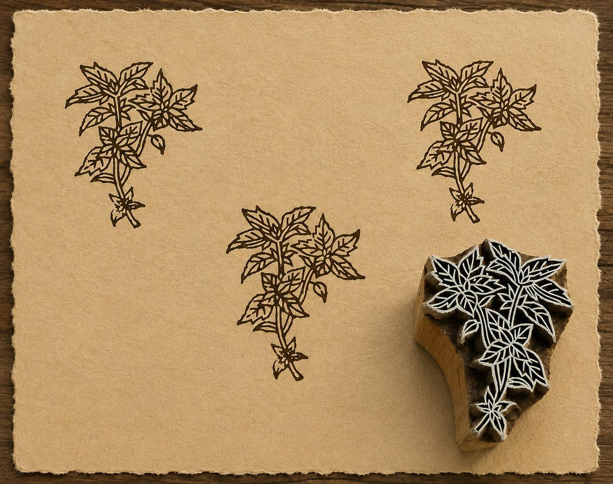 Hand-carved Garden Mint wood block stamp with detailed mint leaf impressions printed in brown ink on textured handmade paper.