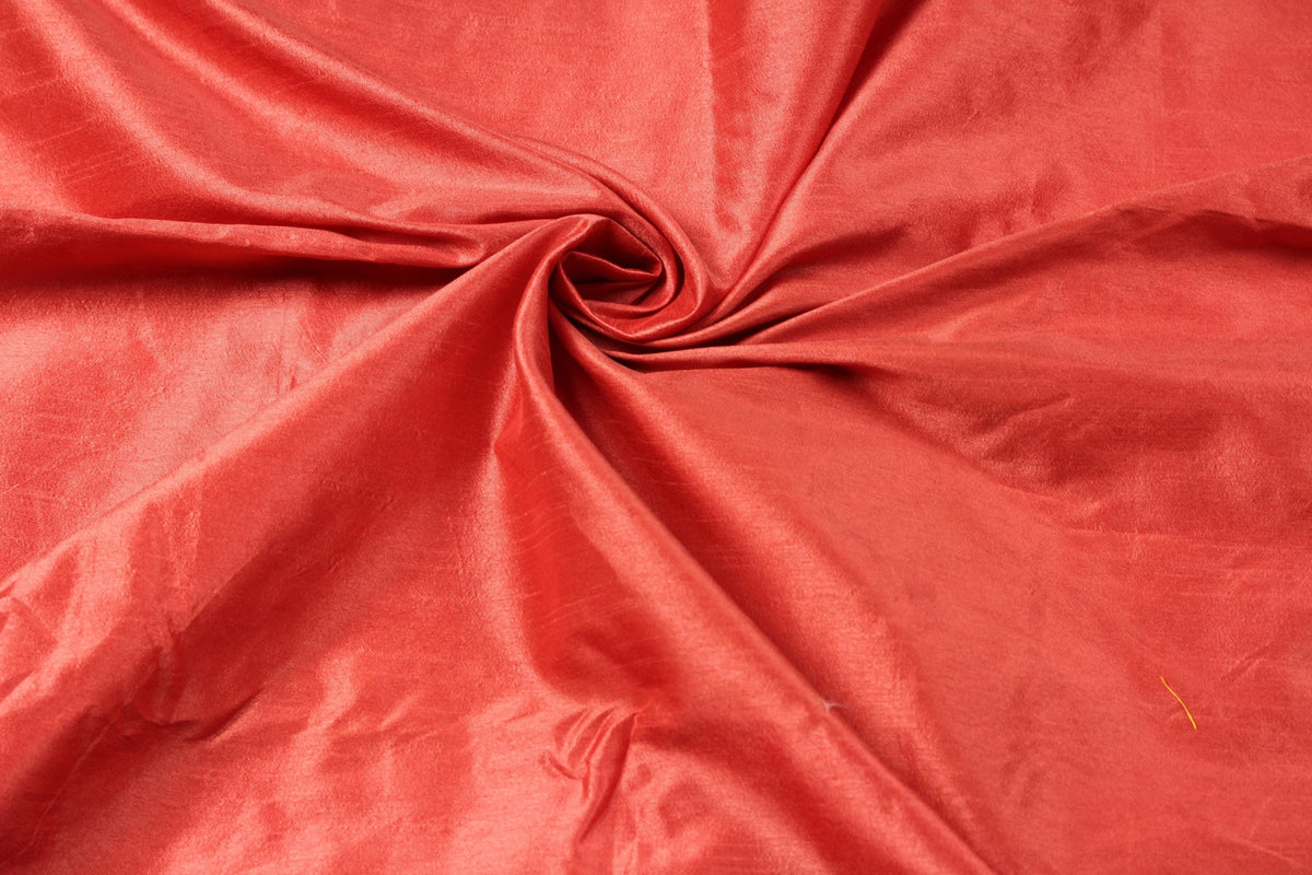 Rich vermilion red faux dupioni fabric showing its subtle textured sheen