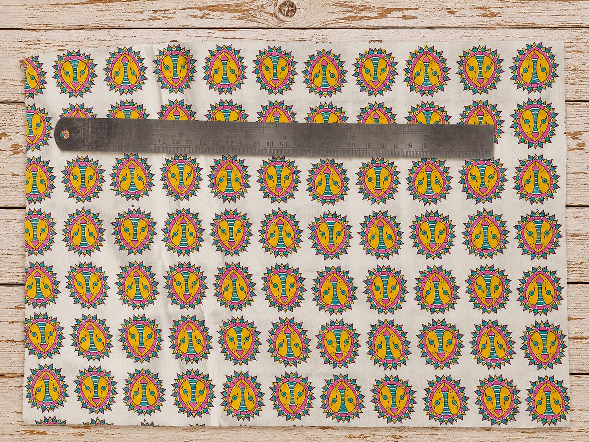 Folk lion motif on hand block printed cotton fabric shown with ruler for scale