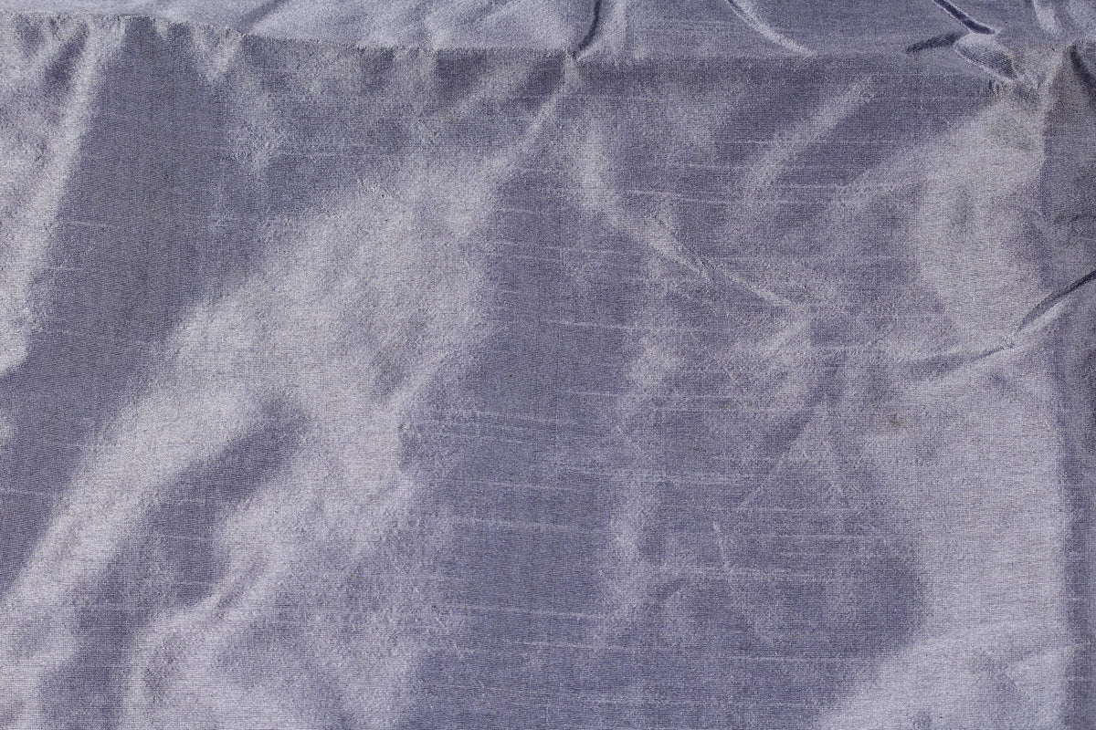 Smoky lavender faux dupioni fabric shown flat, highlighting the subtle textured surface and soft silvery sheen.