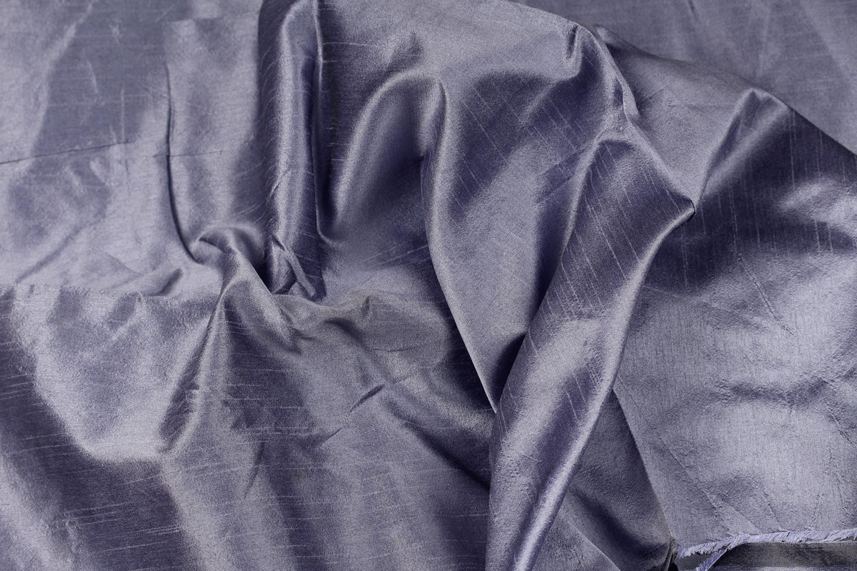 Draped smoky lavender faux dupioni fabric showing its soft folds, subtle sheen and lavender-grey colour.