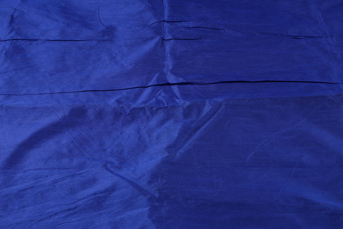 Midnight Sapphire faux dupioni fabric shown flat, highlighting its deep sapphire blue colour and subtle textured sheen.