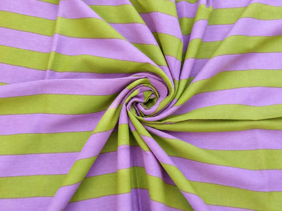 Close view of lavender and lime green stripes on lightweight hand screen printed cotton fabric