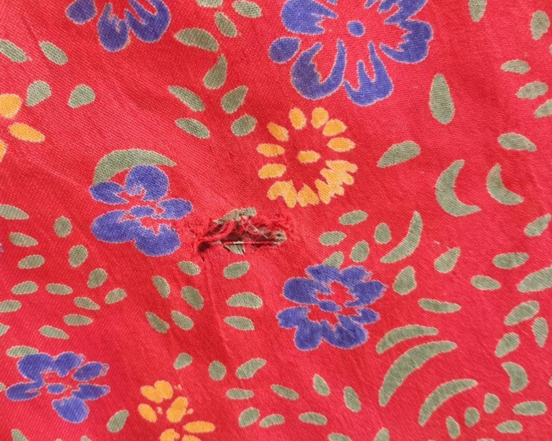 small tear in fabric depicted