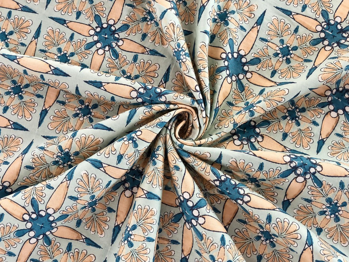 Soft mint mulmul cotton fabric with Vintage Starflower floral block print shown in a drape