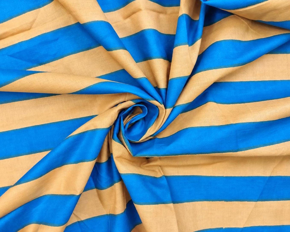 Close view of blue and beige 1.5 inch stripes on lightweight hand screen printed cotton fabric