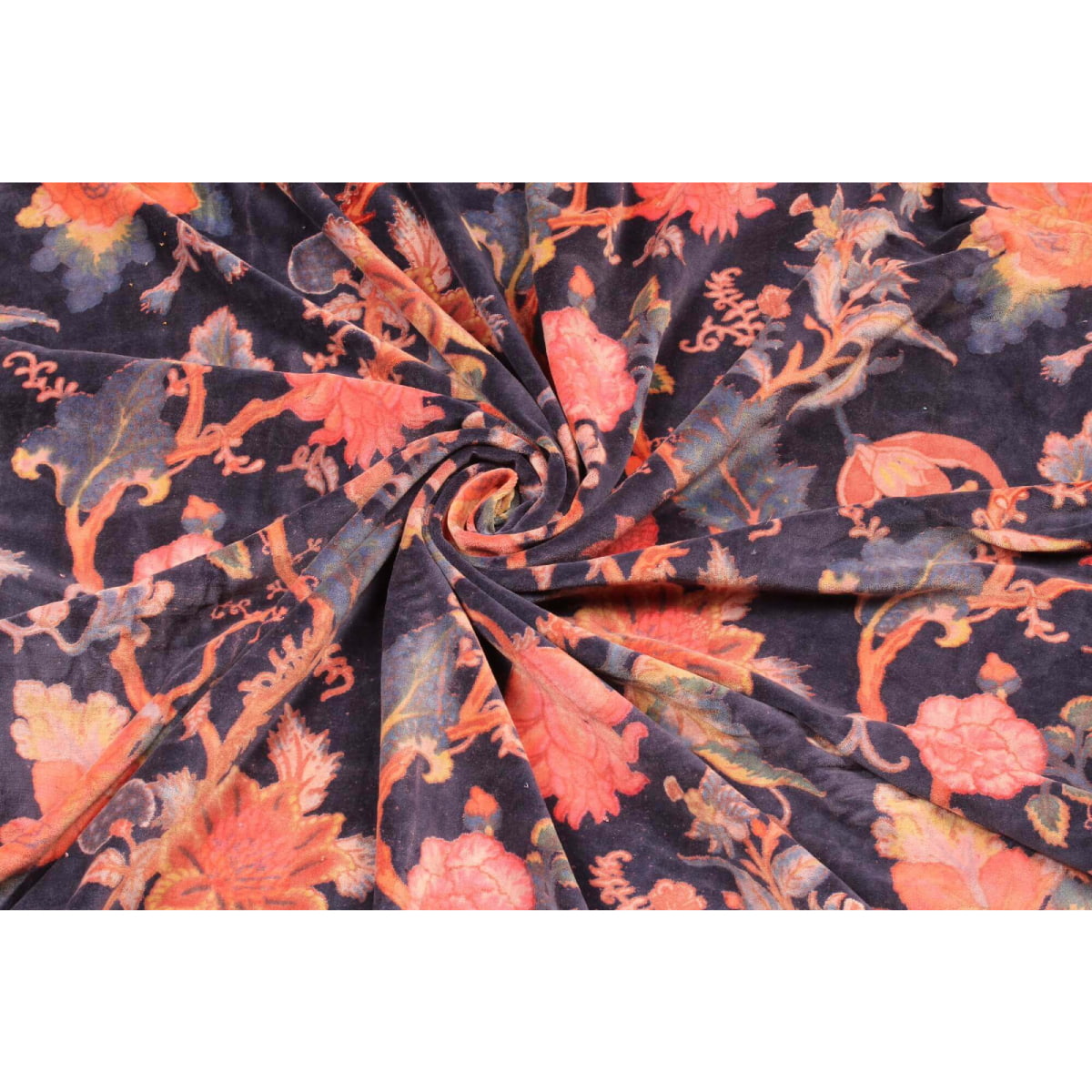 Folded indigo cotton velvet showing plush pile and floral print texture