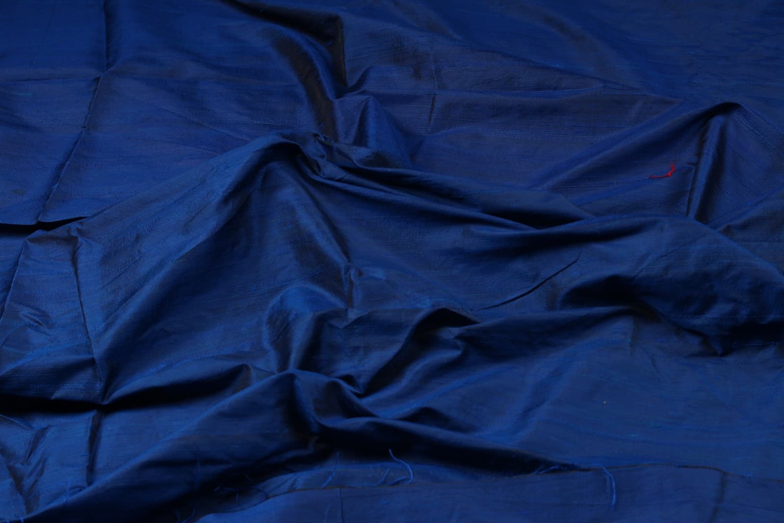 Midnight Blue Dupion Silk Fabric displaying its rich deep blue colour, natural silk texture, and elegant sheen