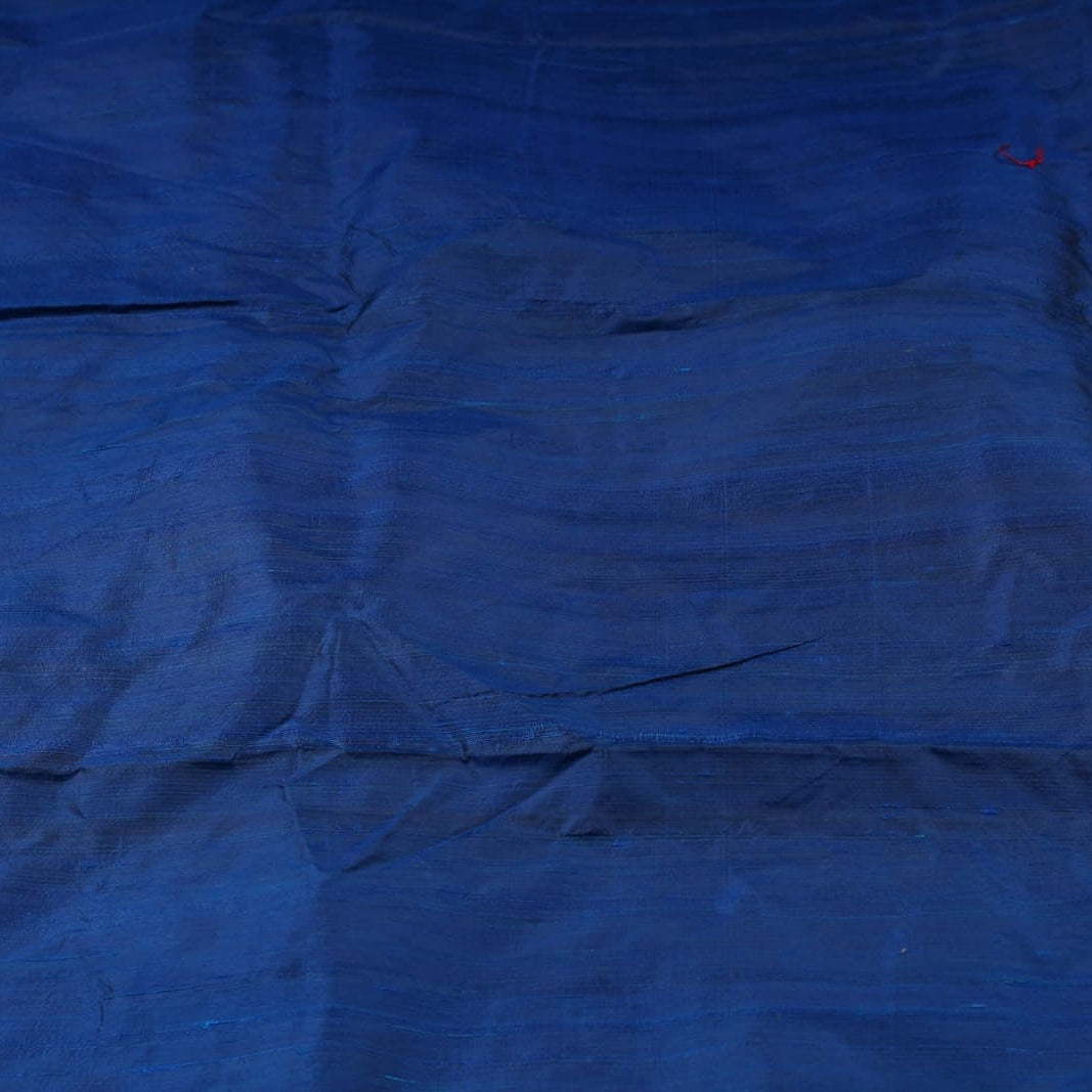 Midnight Blue Dupion Silk Fabric displayed in flowing folds showing its rich colour and luxurious silk sheen