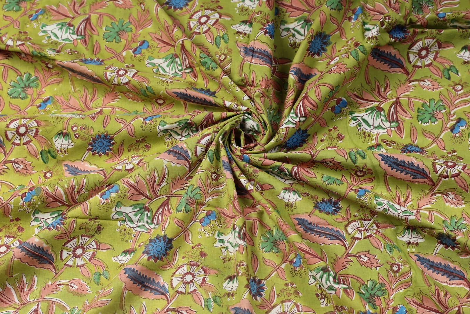 Olive Woodland Wildflower cotton fabric gathered to showcase drape, texture, and multicolor floral block print