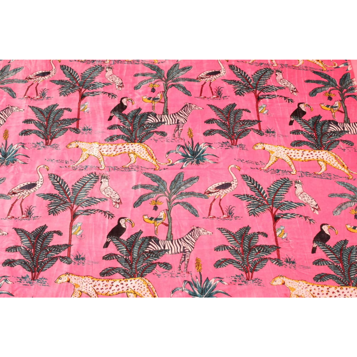 Pink hand-printed cotton velvet with cheetah, zebra & tropical birds – flatlay