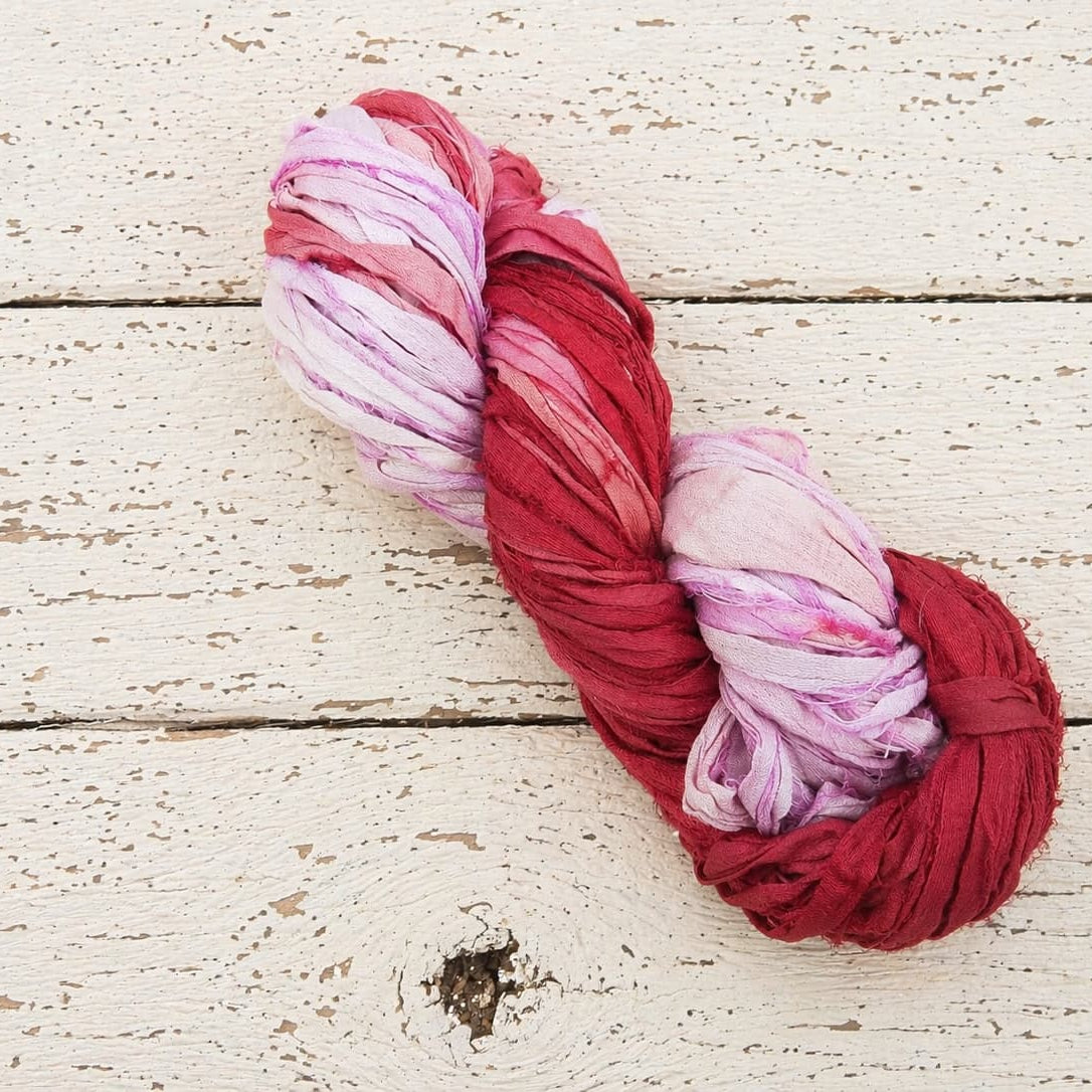 Single skein of Berry Blossom recycled sari silk ribbon yarn
