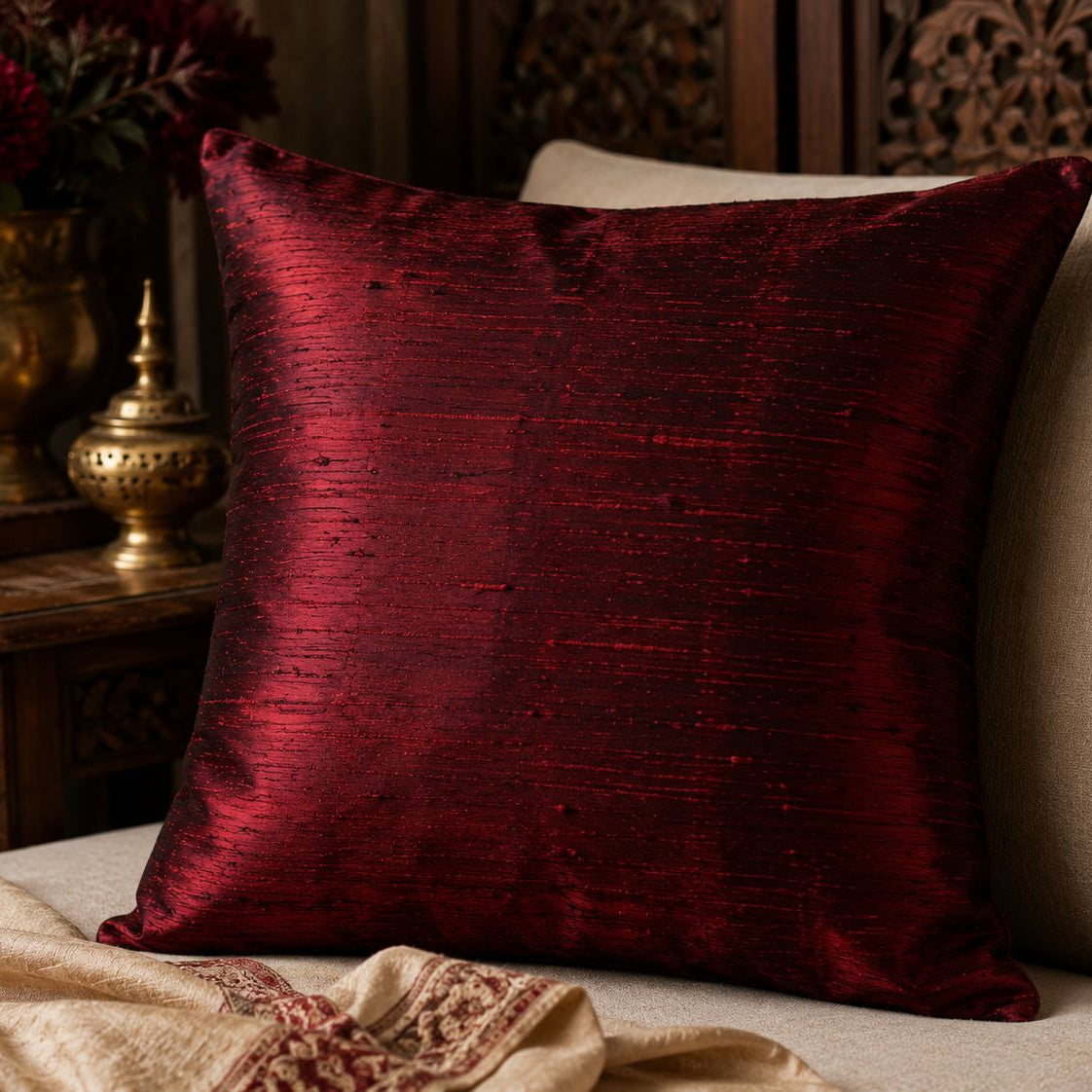 Decorative cushion cover made from ruby red Dupion silk fabric.