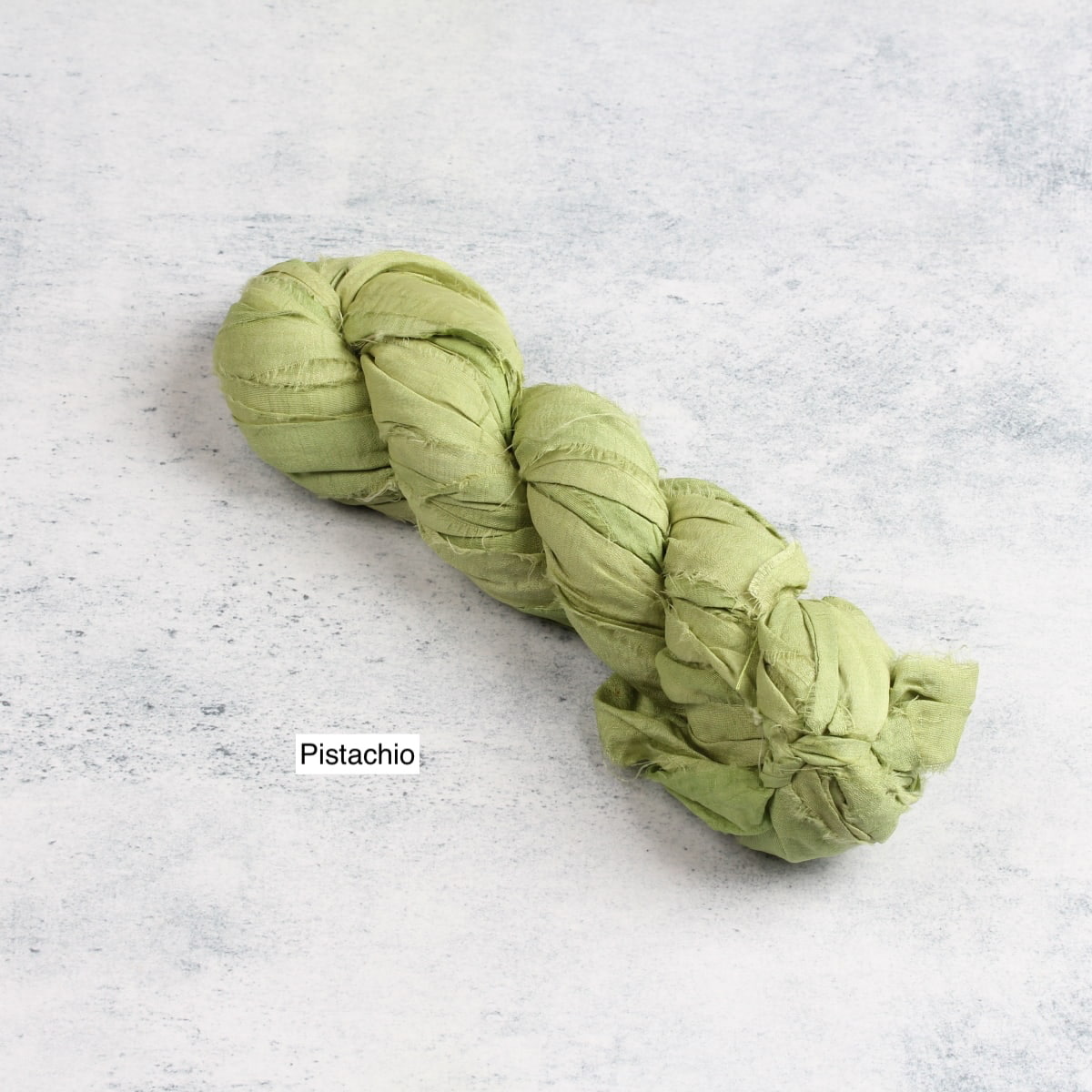 Pistachio green sari silk ribbon for fiber art and crafts