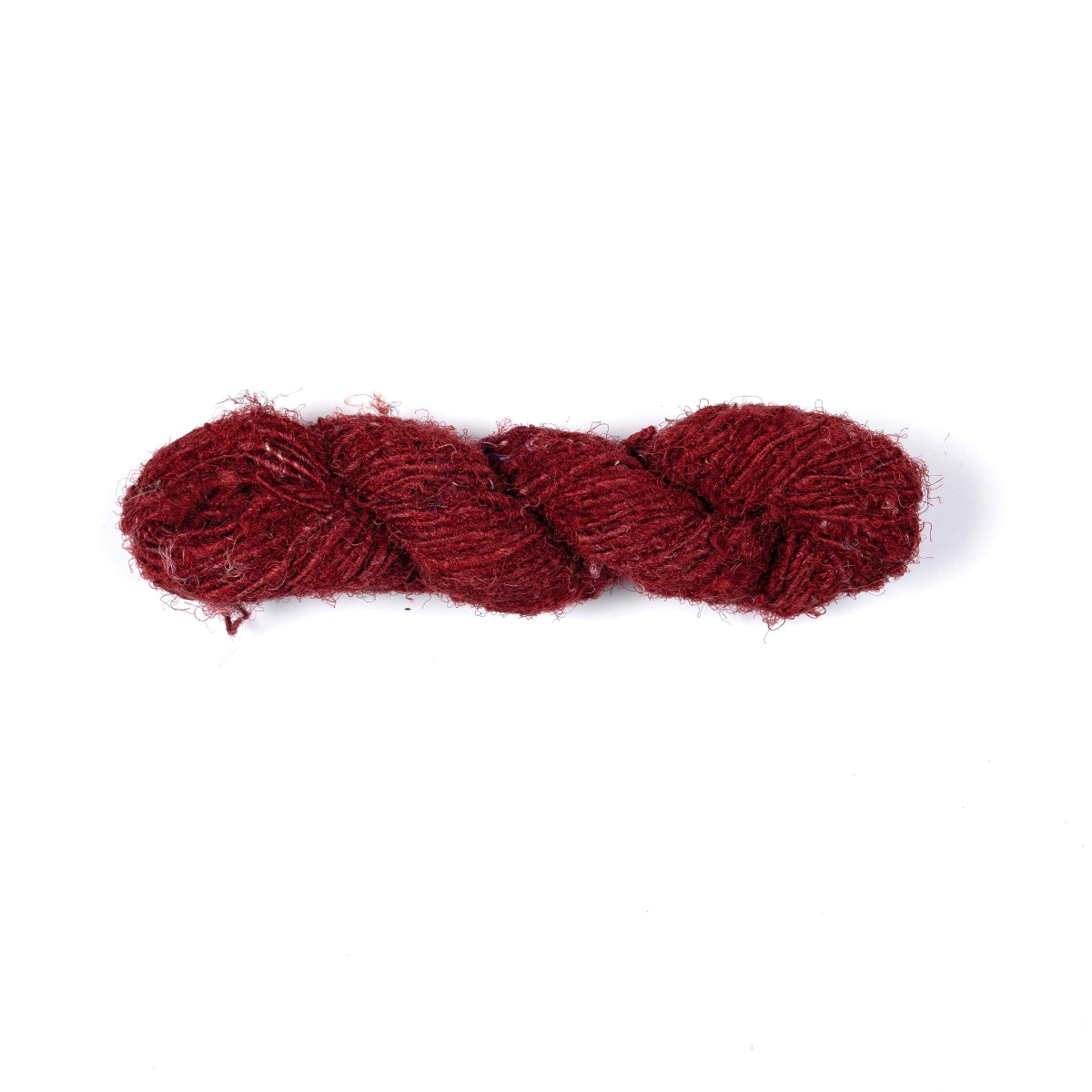 Dark red Sari Silk Yarn – hand-spun recycled silk skein with rich color.