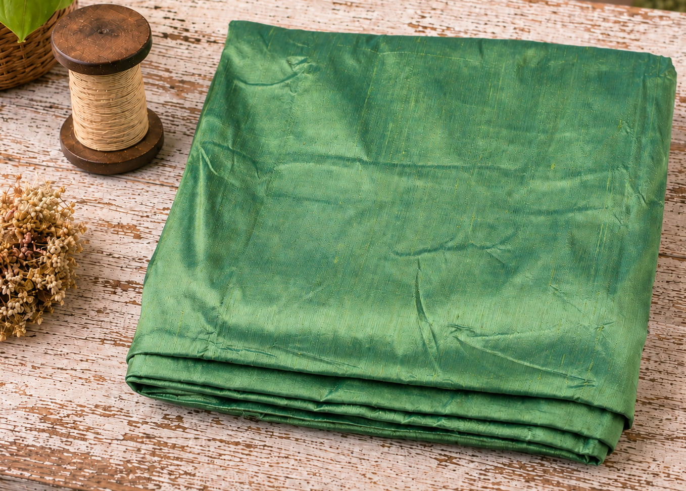 Seafoam Green Dupion Silk Fabric folded to showcase its soft seafoam green colour, natural silk texture, and elegant sheen