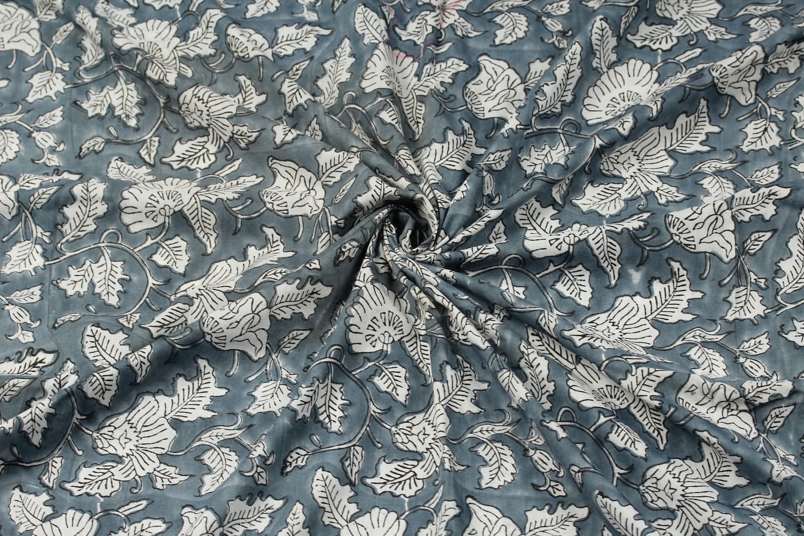 Slate Meadow Bloom floral block print cotton fabric gathered to display drape, texture, and botanical pattern detail