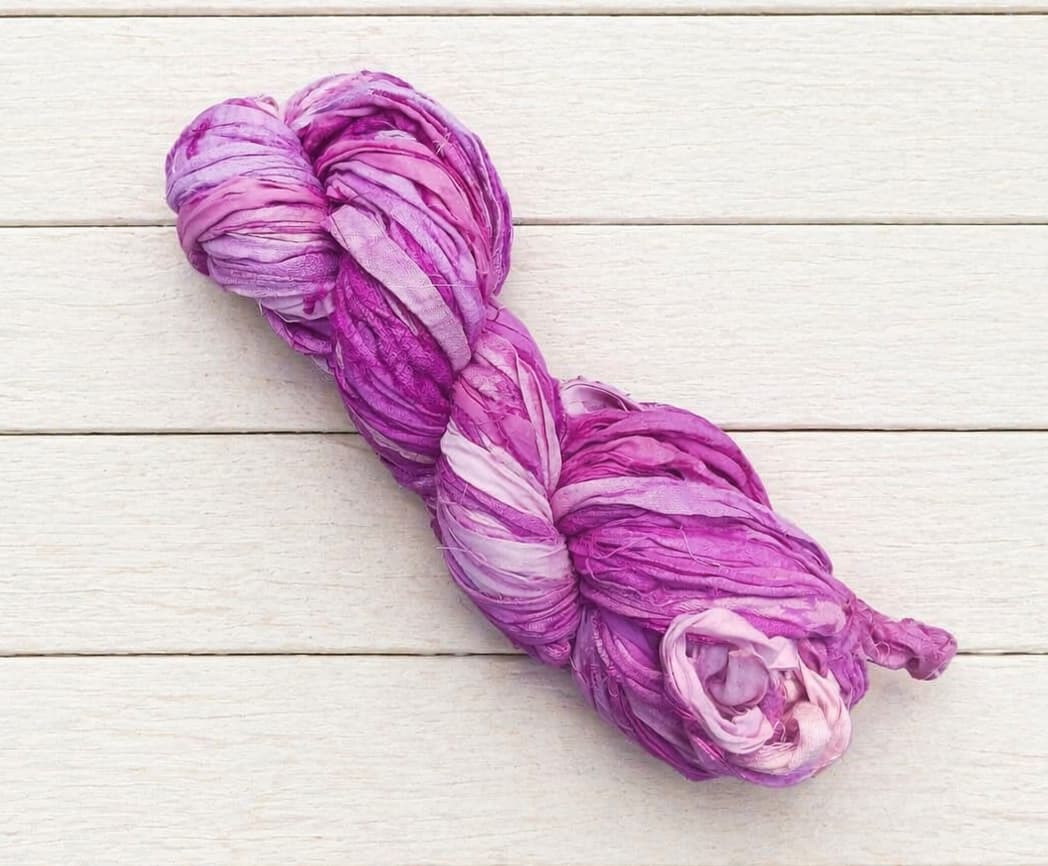 Single skein of Orchid Bloom sari silk ribbon yarn