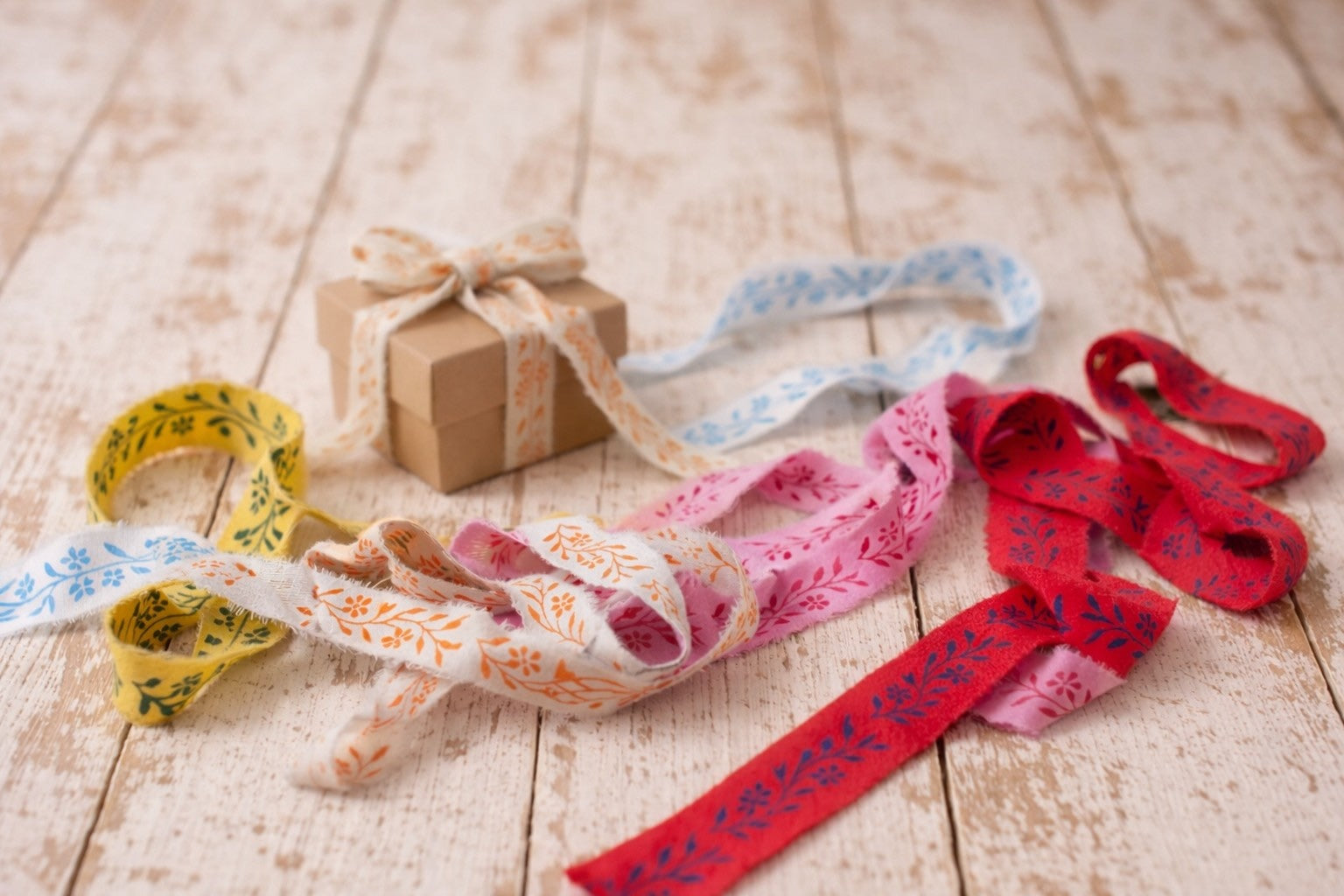 Collection of hand block printed saree silk ribbons made from recycled vintage silk saris