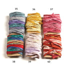 Assorted shades of multi-color Sari Silk Ribbon on cardboard cards