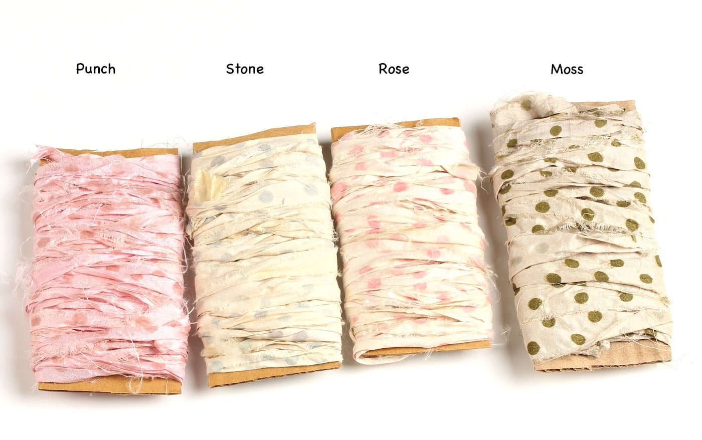 Polka dot sari silk ribbons in pink, gray, and green shades displayed together