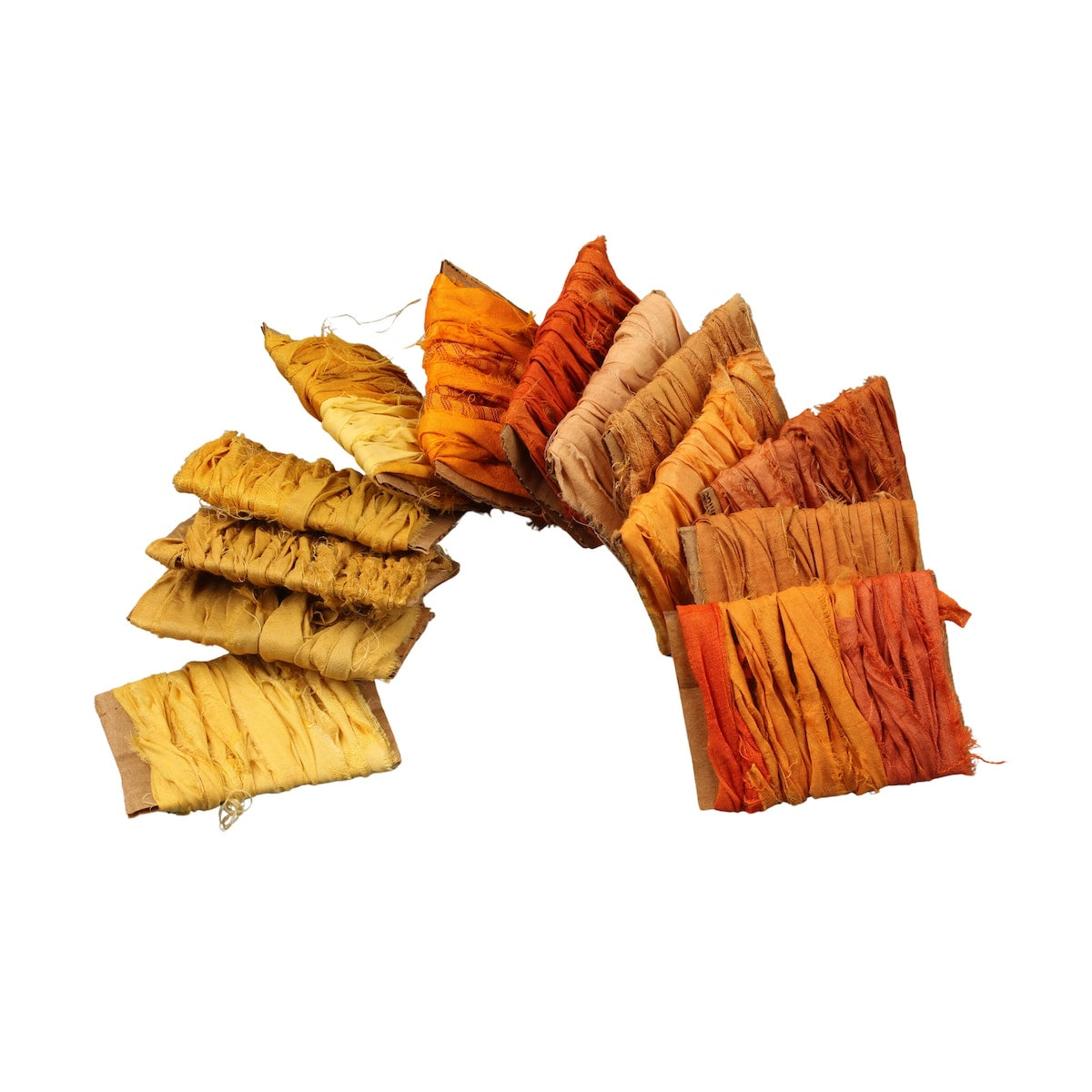 Orange and yellow sari silk ribbons in assorted shades displayed on cardboard cards