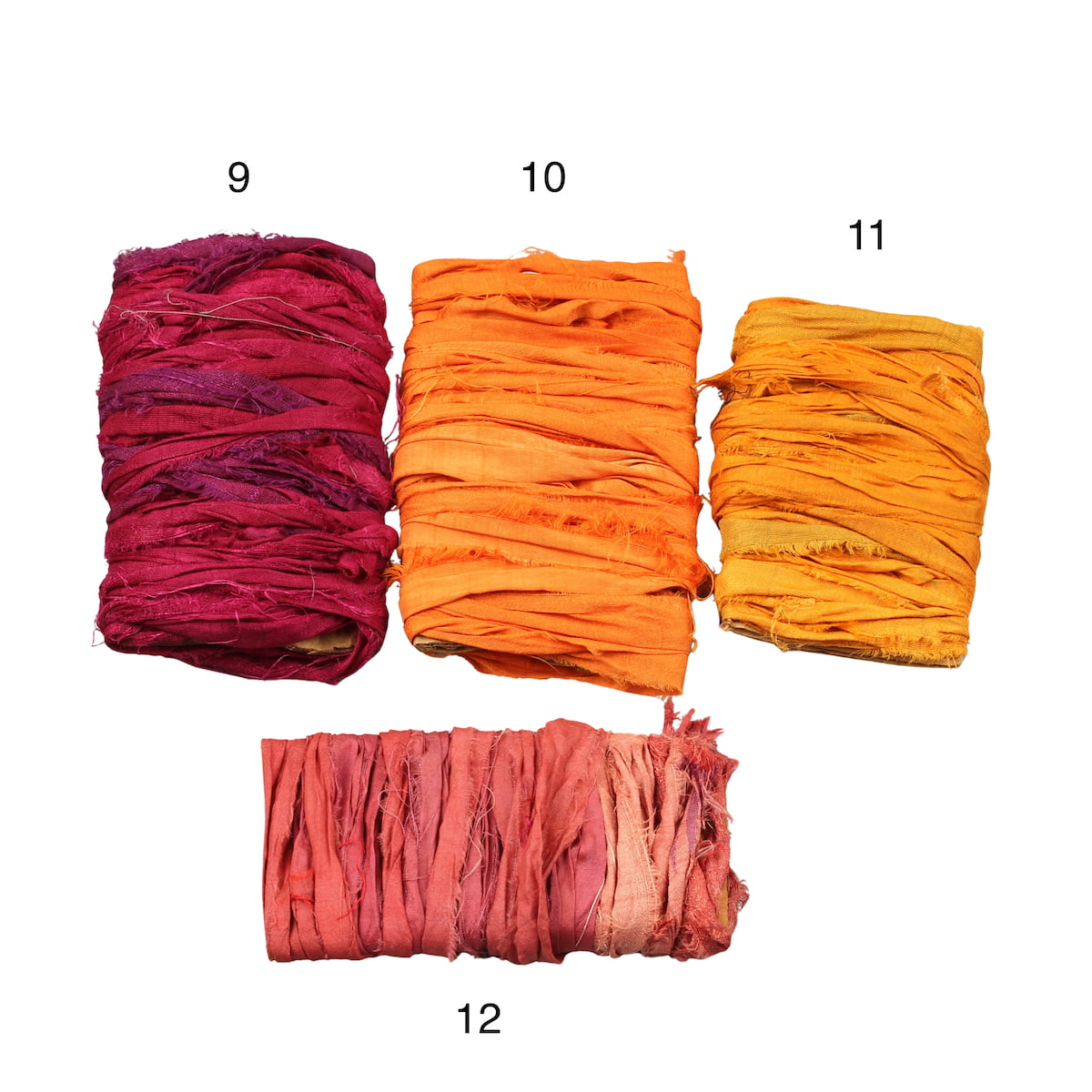 Assorted yellow and red sari silk ribbons in mixed tones